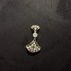 A luxurious gold diamond necklace with earrings set, displayed on a mannequin bust.
