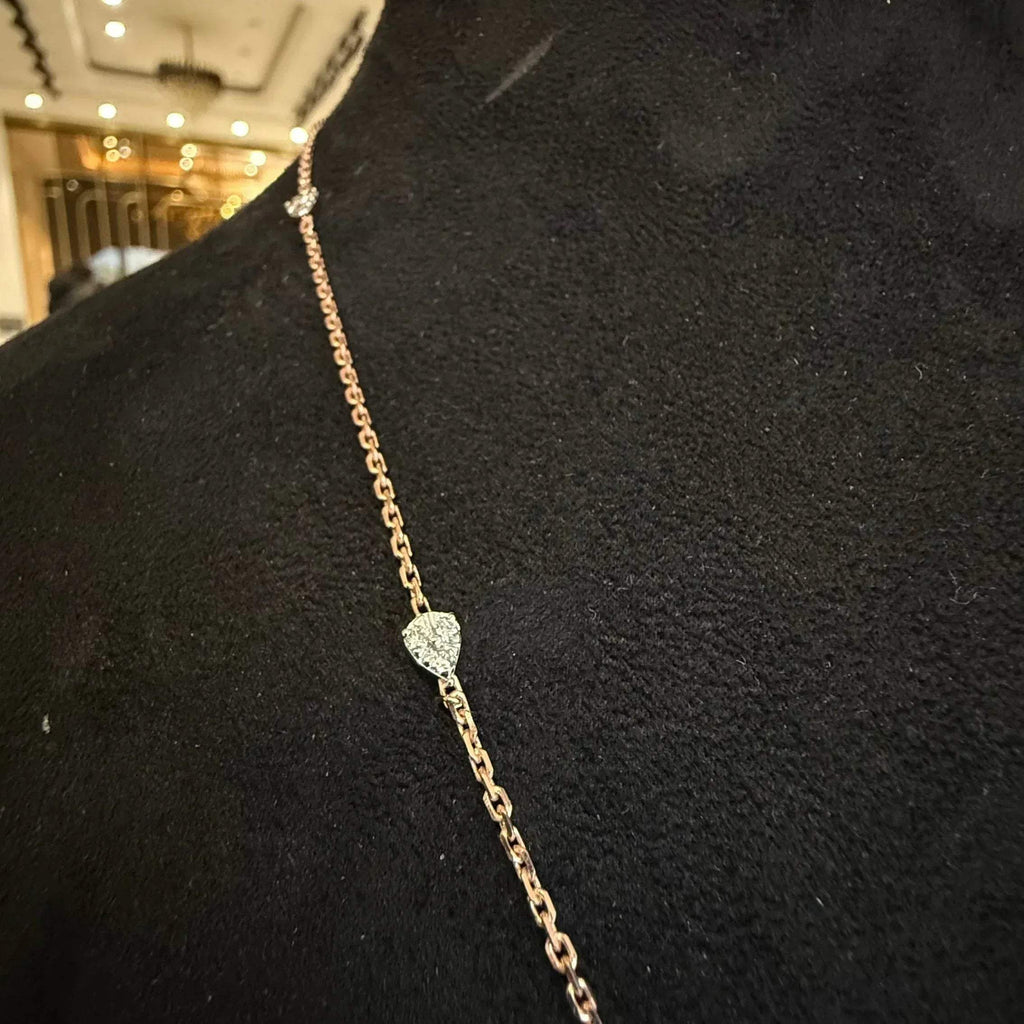 Modern diamond chain necklace set with hexagon pendant on display.