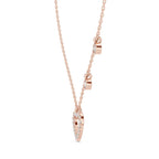 Rose gold necklace with a heart-shaped pendant on a white background