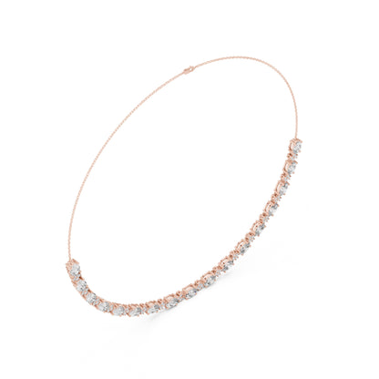 Rose gold necklace with diamonds on a white background