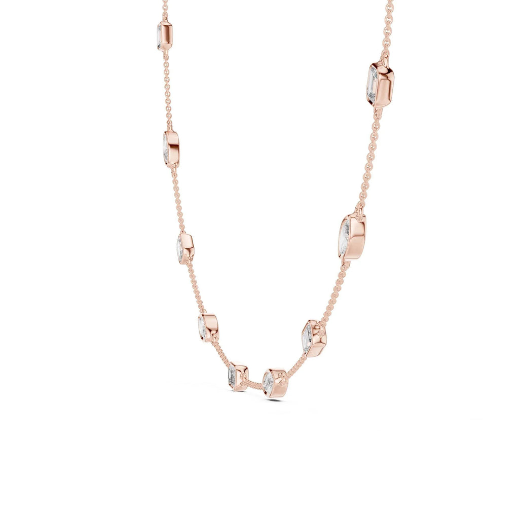 Rose gold necklace with diamonds on a white background