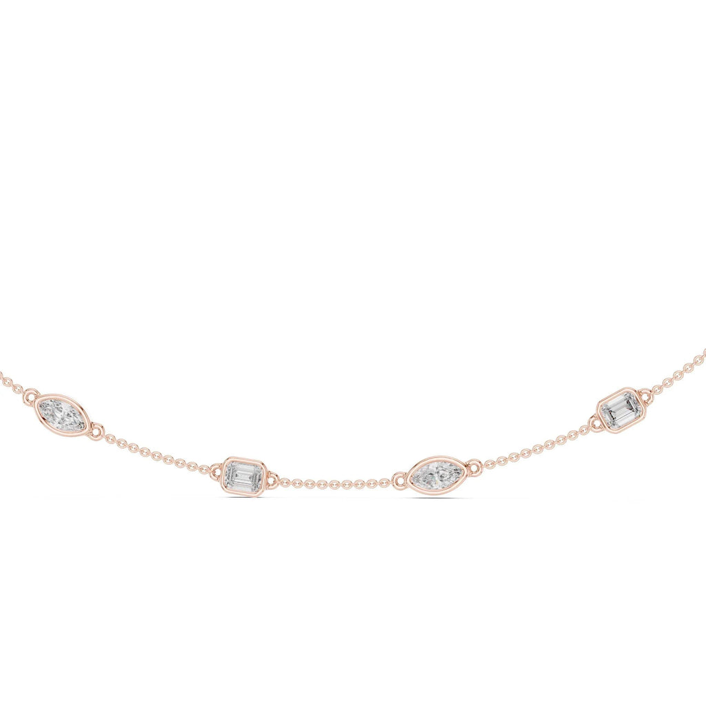 Rose gold necklace with diamond accents on a white background