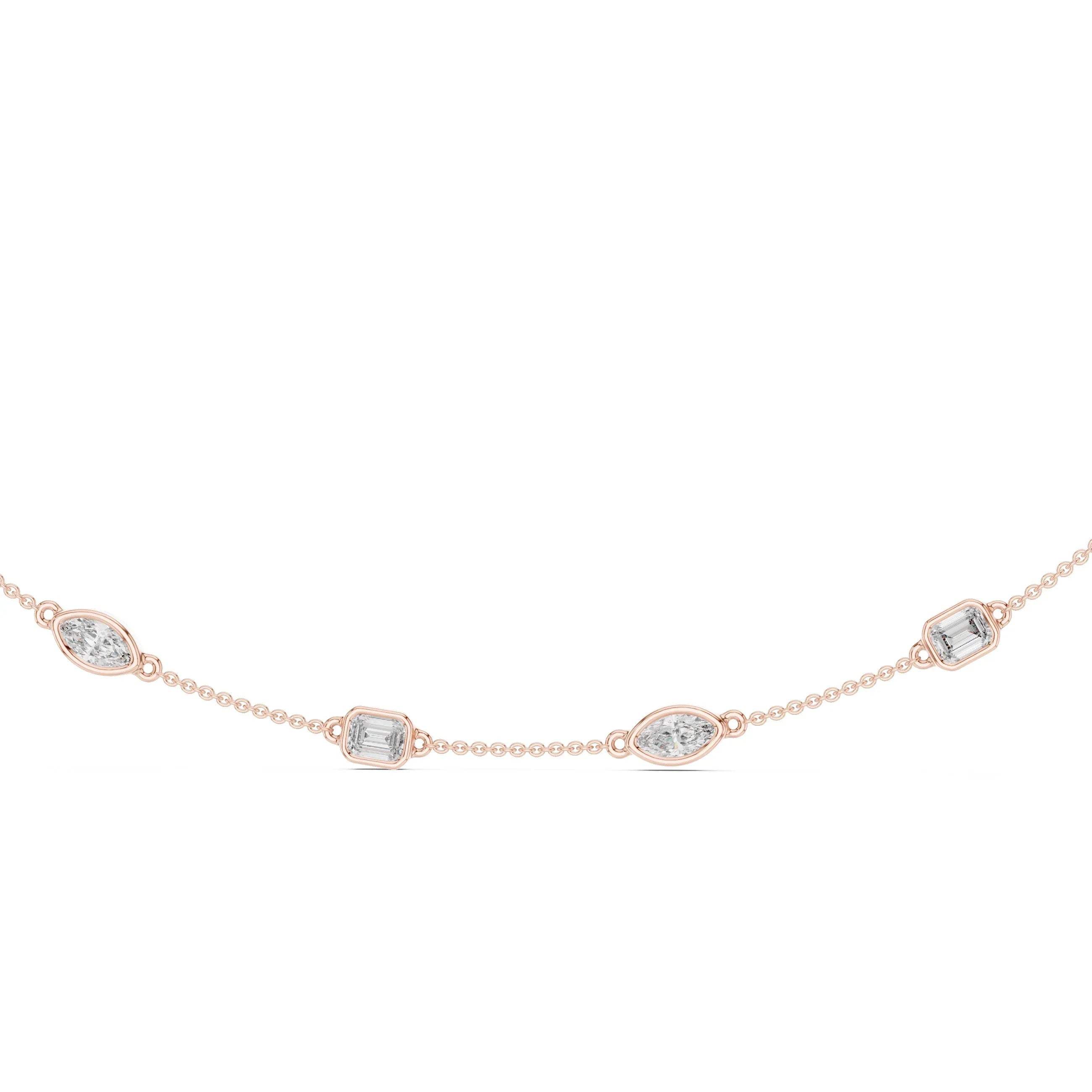 Rose gold necklace with diamond accents on a white background