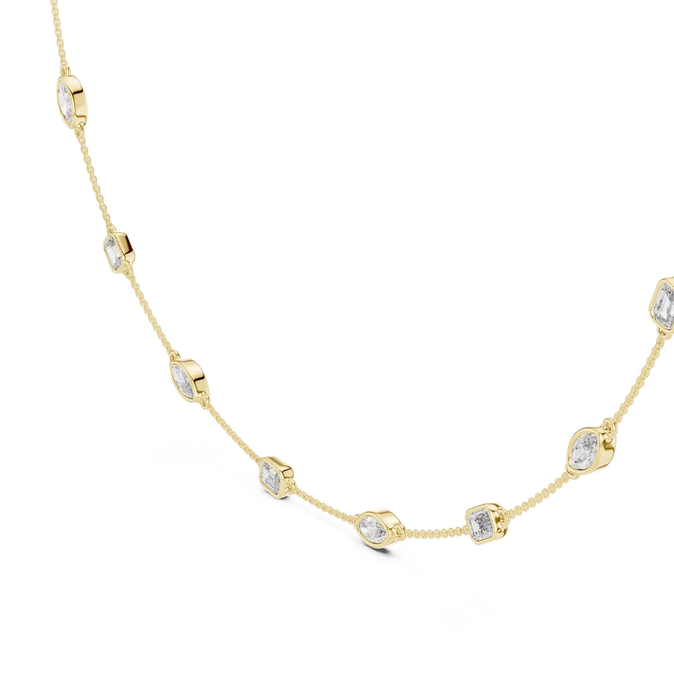 Gold necklace with diamond accents on a white background