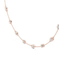 Rose gold necklace with diamonds on a white background
