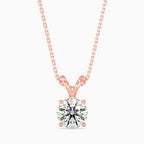 Rose gold pendant with a round brilliant-cut solitaire diamond on a delicate chain in rose gold.
