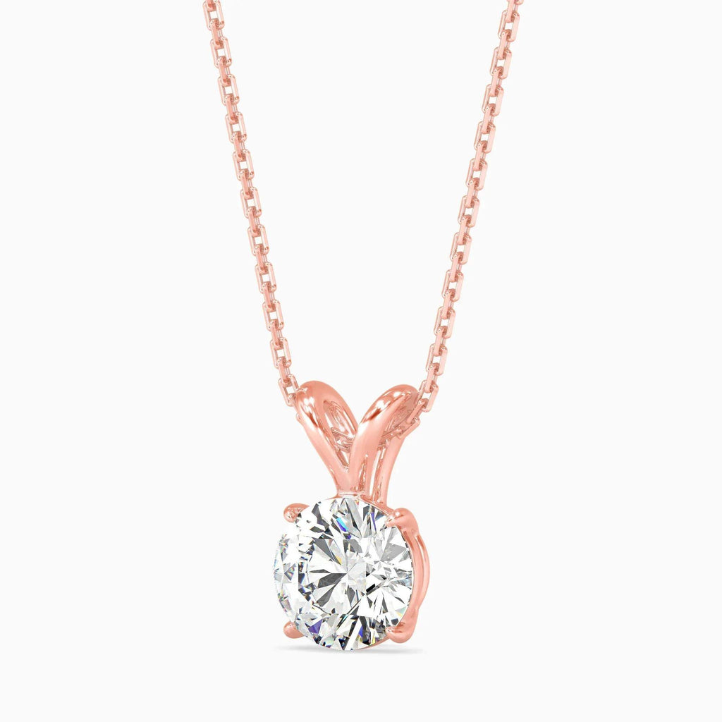Rose gold necklace with a solitaire diamond pendant on a white background
