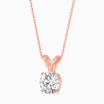 Rose gold necklace with a solitaire diamond pendant on a white background