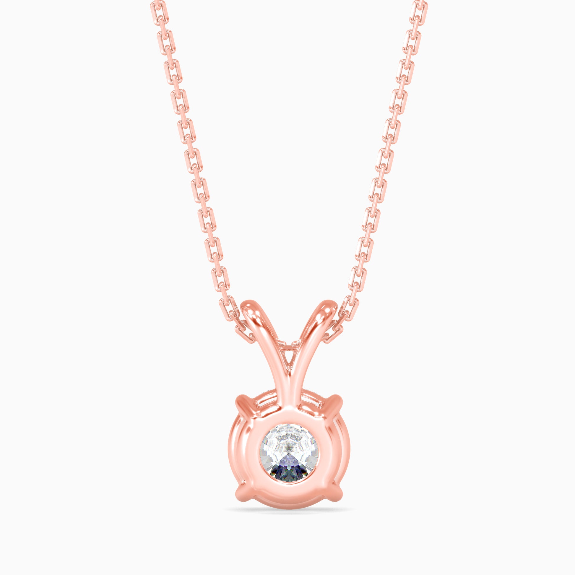 Rose gold necklace with a round pendant on a white background