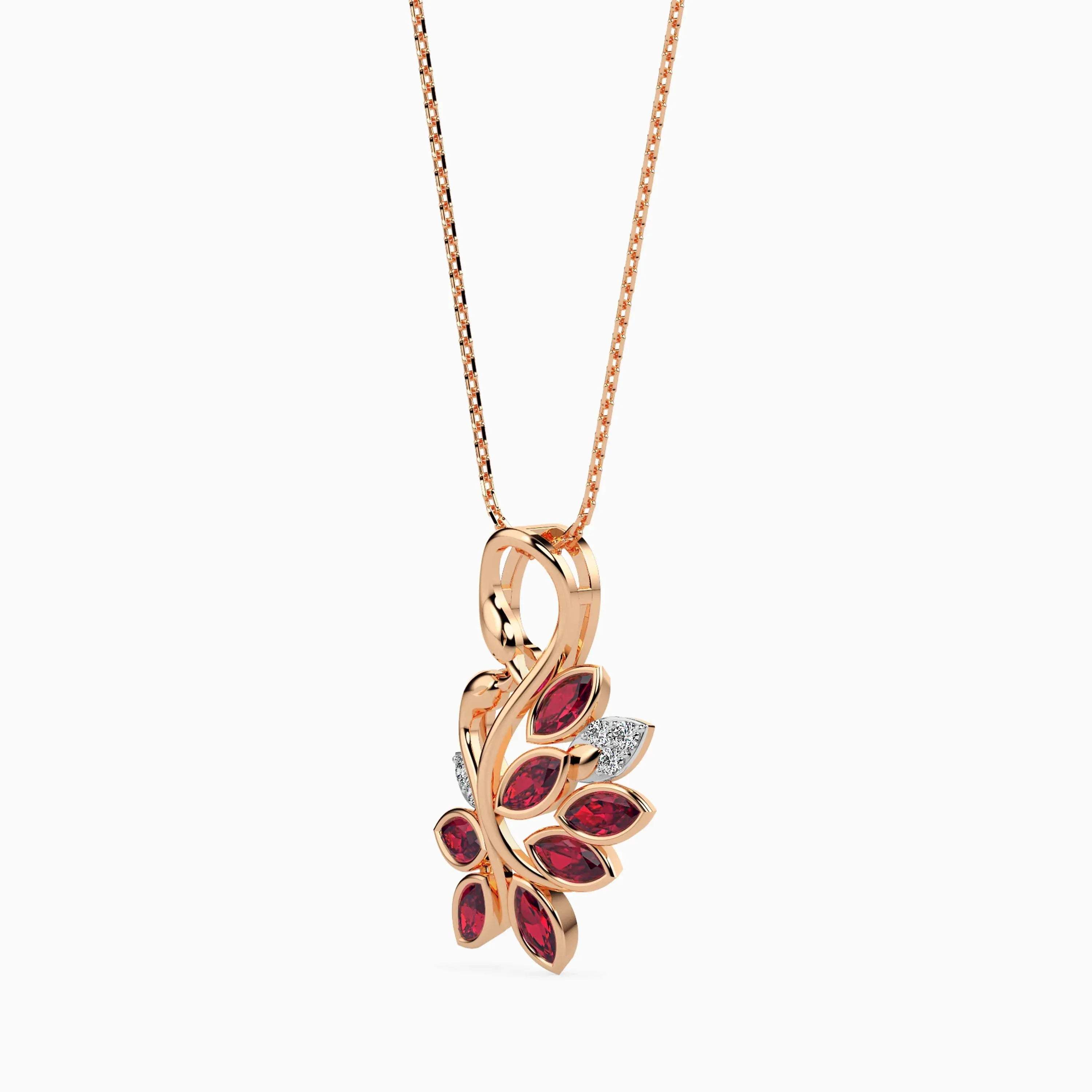 Rose gold diamond necklace with a leaf-shaped pendant featuring ruby gemstones on a white background