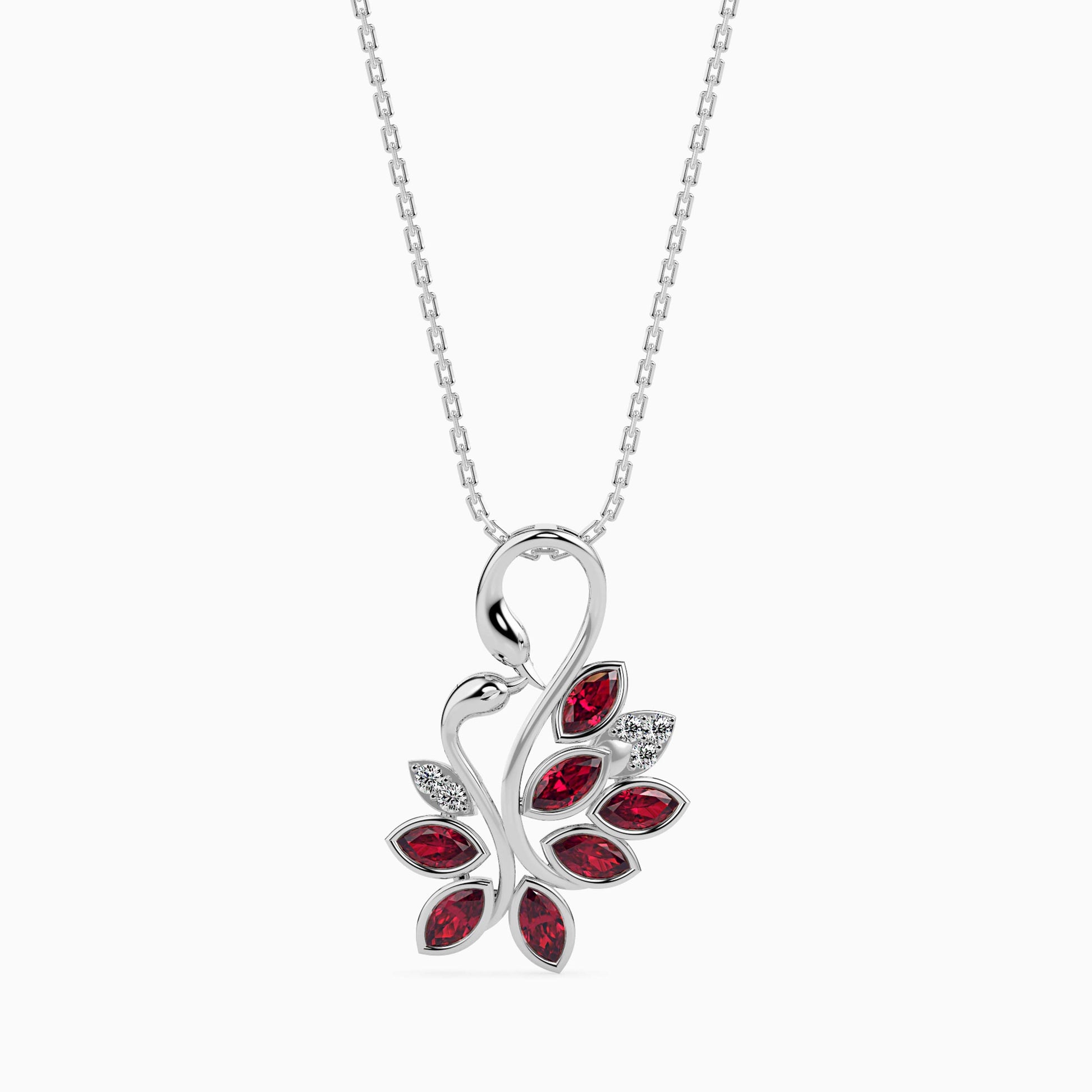 white gold diamond pendant necklace with a red gemstone pendant on a white background