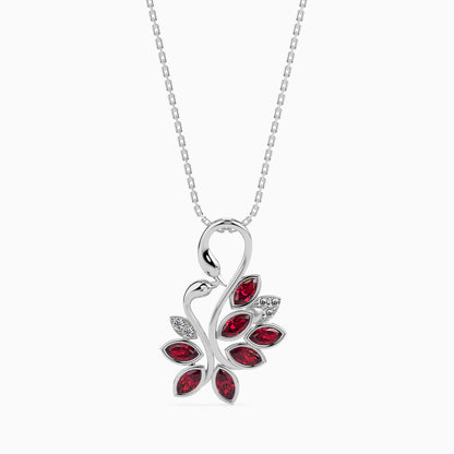 white gold diamond pendant necklace with a red gemstone pendant on a white background