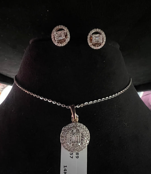A mannequin showcasing a gold diamond pendant and earrings set, with the pendant hanging from a chain and the earrings displayed above.