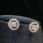 A mannequin showcasing a gold diamond earrings displayed.