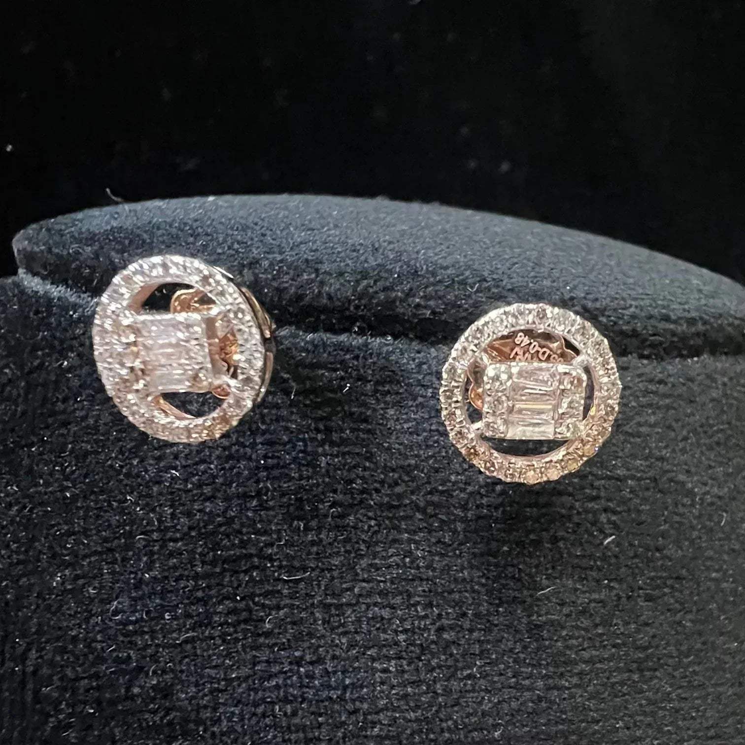 A mannequin showcasing a gold diamond earrings displayed.