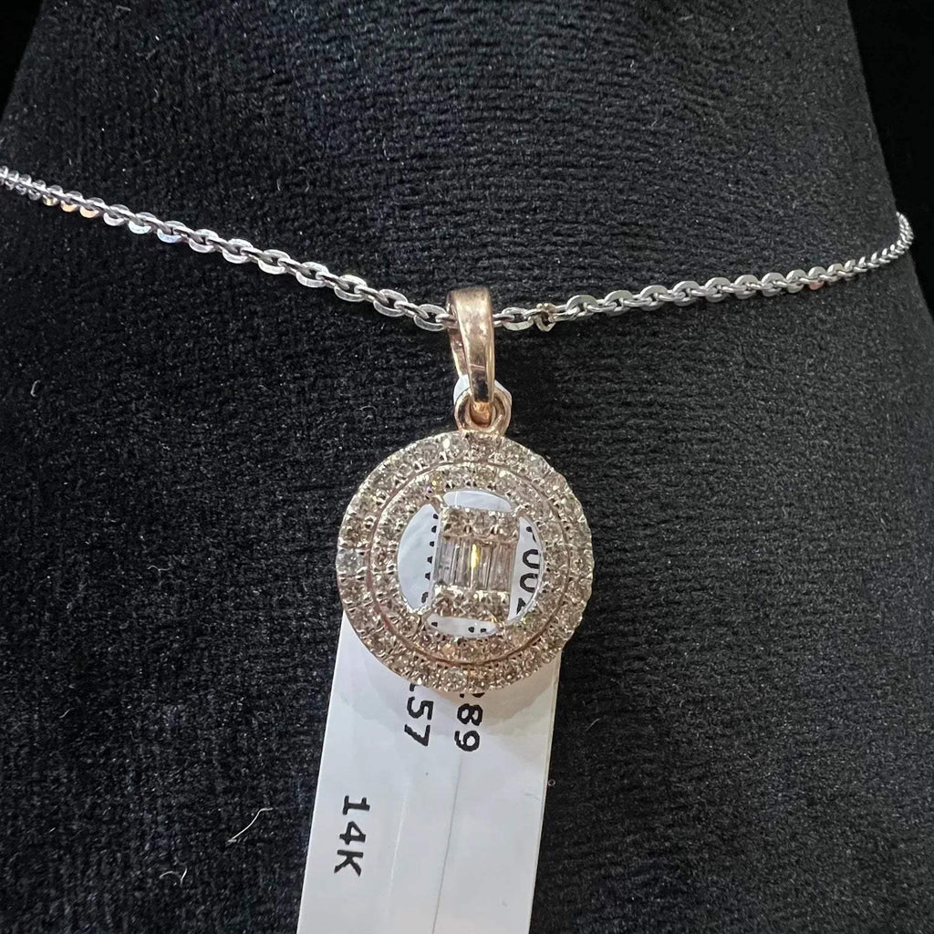 A mannequin showcasing a gold diamond pendant hanging from a chain displayed.