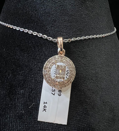 A mannequin showcasing a gold diamond pendant hanging from a chain displayed.