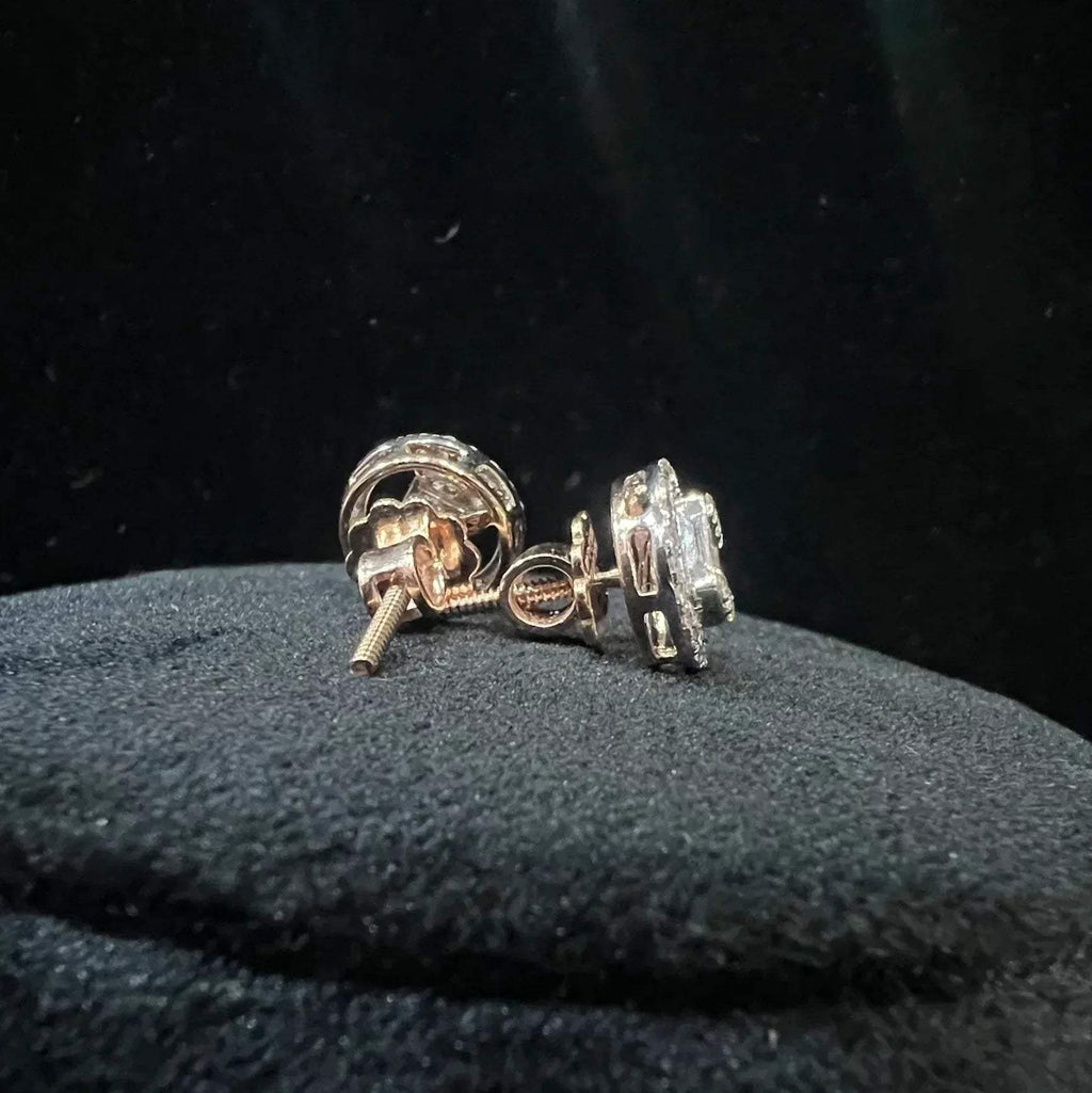 A mannequin showcasing gold diamond stud earrings displayed.