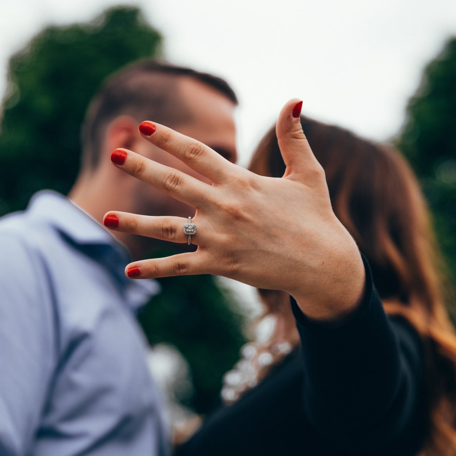 Person wearing a ring with a blurred background