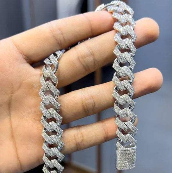 Luxury gold Cuban chain necklace with pavé-set diamonds and bold interlocking links for a stylish statement look.