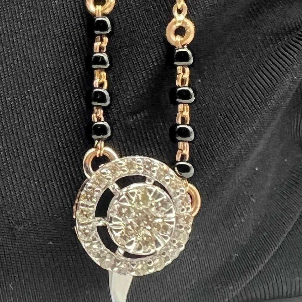 Elegant gold diamond mangalsutra with round halo diamond pendant and dual black bead gold chain, perfect for daily wear and modern bridal style.
