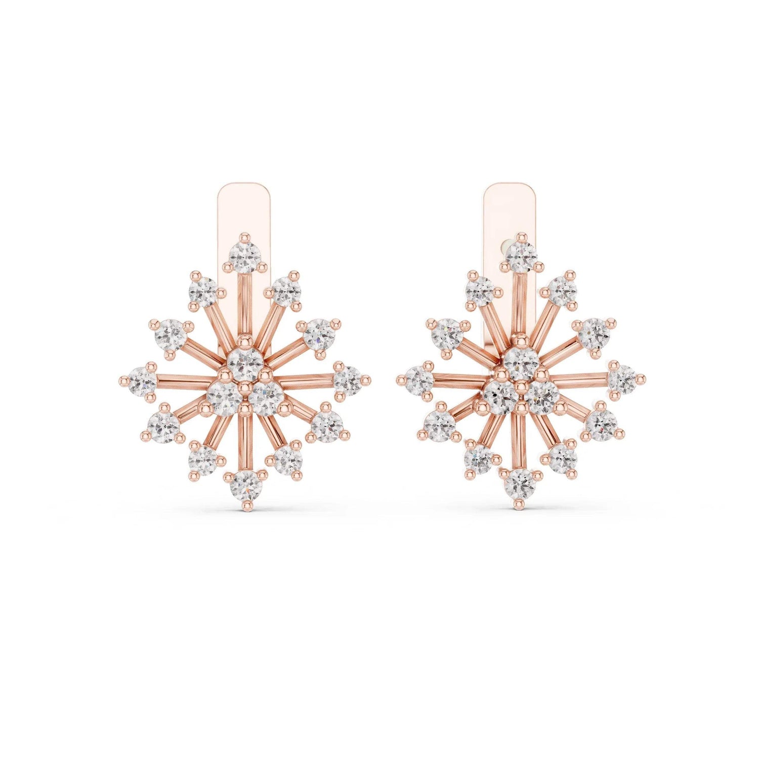 Rose gold and lab grown diamond snowflake earrings on a white background