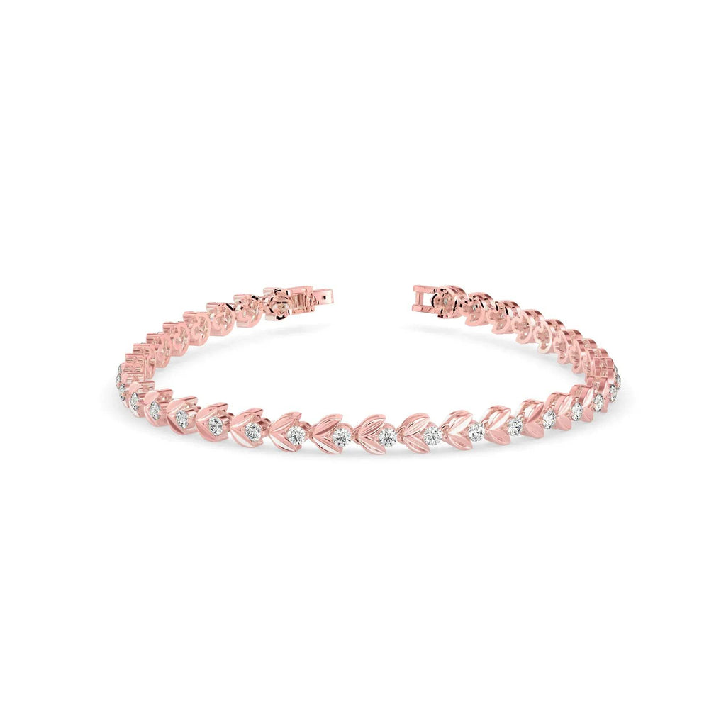 Gold bracelet with small lab grown diamonds on a white background.