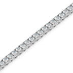 gold bracelet with lab grown diamonds on a white background.