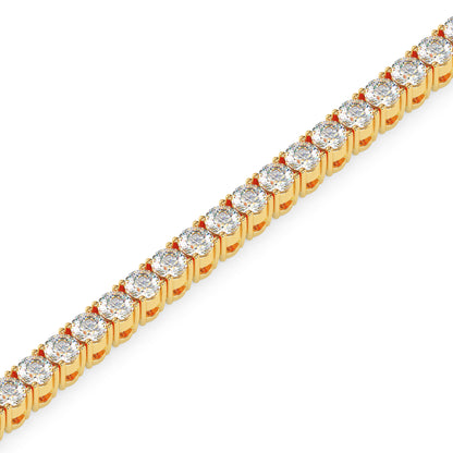 gold bracelet with lab grown diamonds on a white background.