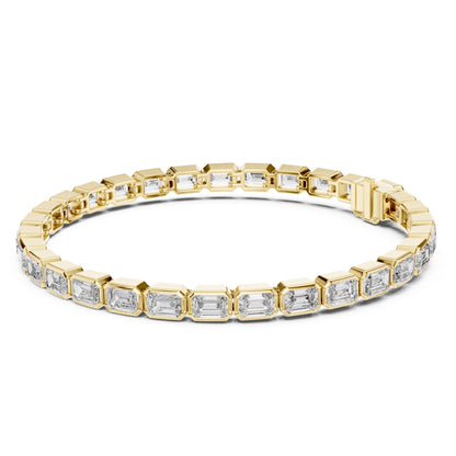 Yellow gold bracelet with emerald-cut lab grown diamond accents on a white background