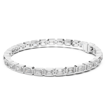 Rose gold bracelet with emerald-cut lab grown diamond accents on a white background.