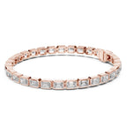 Rose gold bracelet with emerald-cut lab grown diamond accents on a white background.