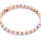 Rose gold bracelet with emerald-cut lab grown diamond accents on a white background.