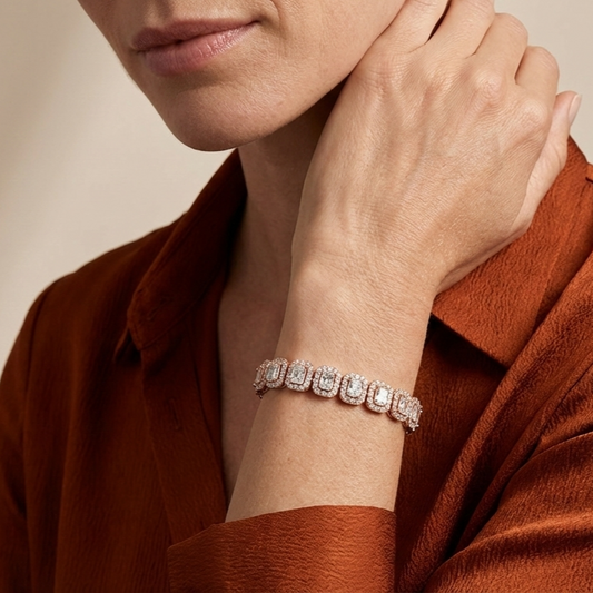 Close-up of a person wearing a lab grown diamond bracelet on a neutral background