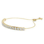 Yellow gold bracelet with lab grown diamond accents on a white background