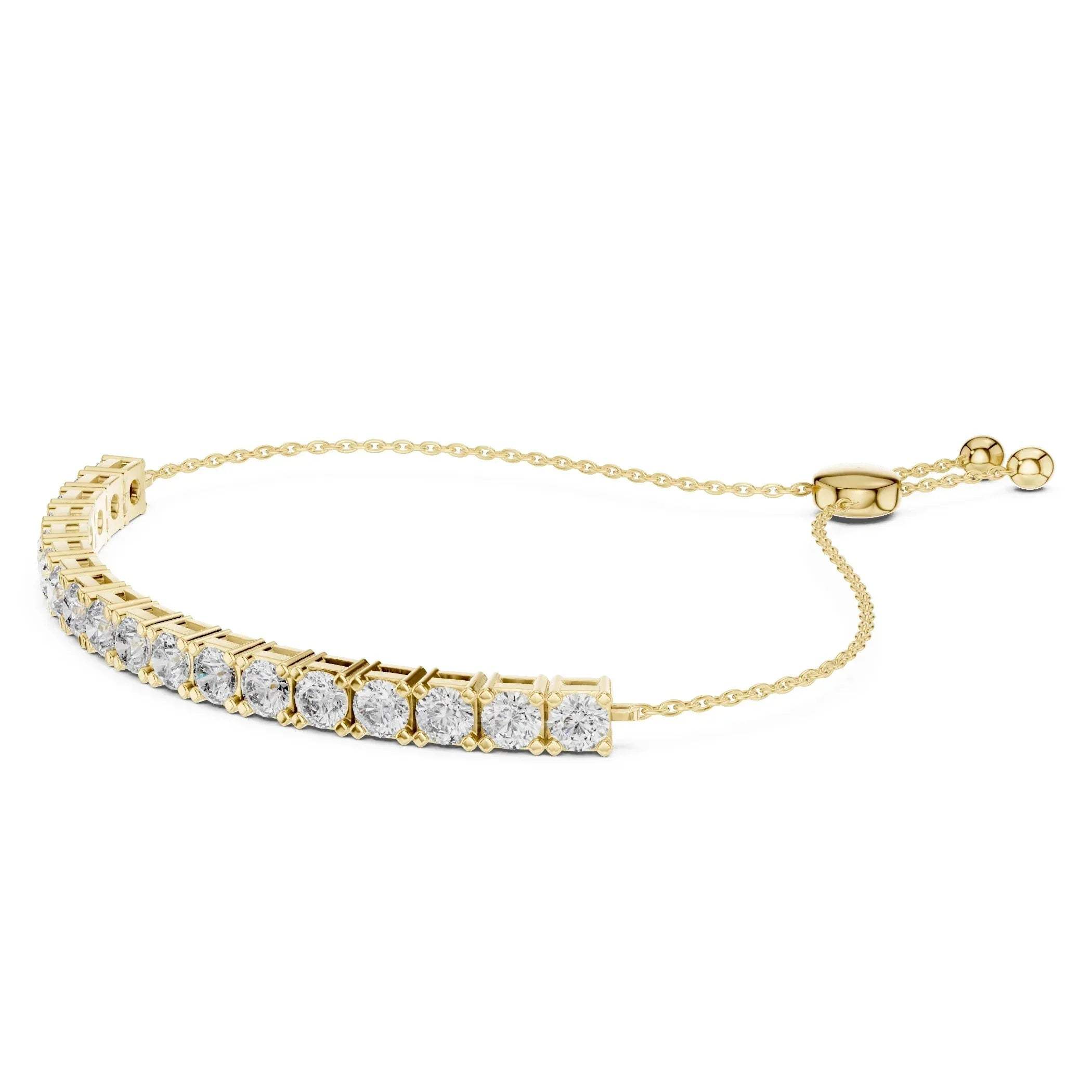 Yellow gold bracelet with lab grown diamond accents on a white background