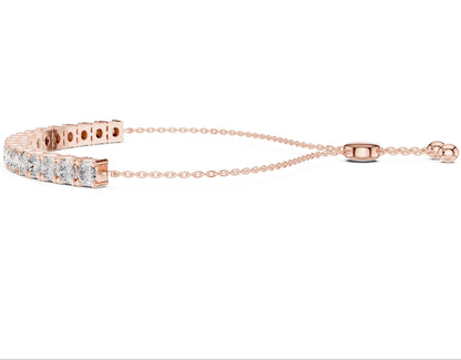 Rose gold bracelet with lab grown diamond accents on a white background