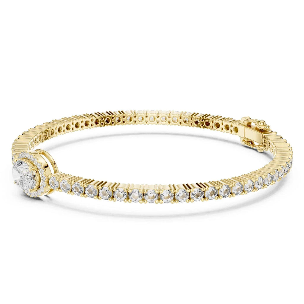Yellow gold bracelet with lab grown diamonds on a white background