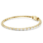 Yellow gold and lab grown diamond bracelet on a white background