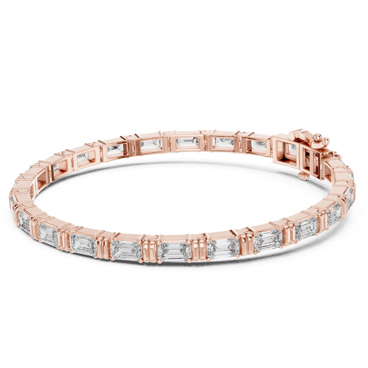 Rose gold bracelet with emerald cut lab grown diamonds on a white background