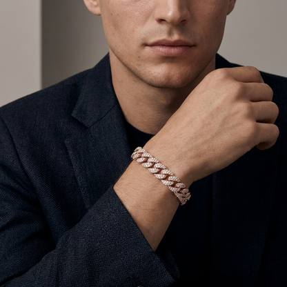 A man in black suit is showing a lab grown diamond cuban link bracelet worn in his hand.