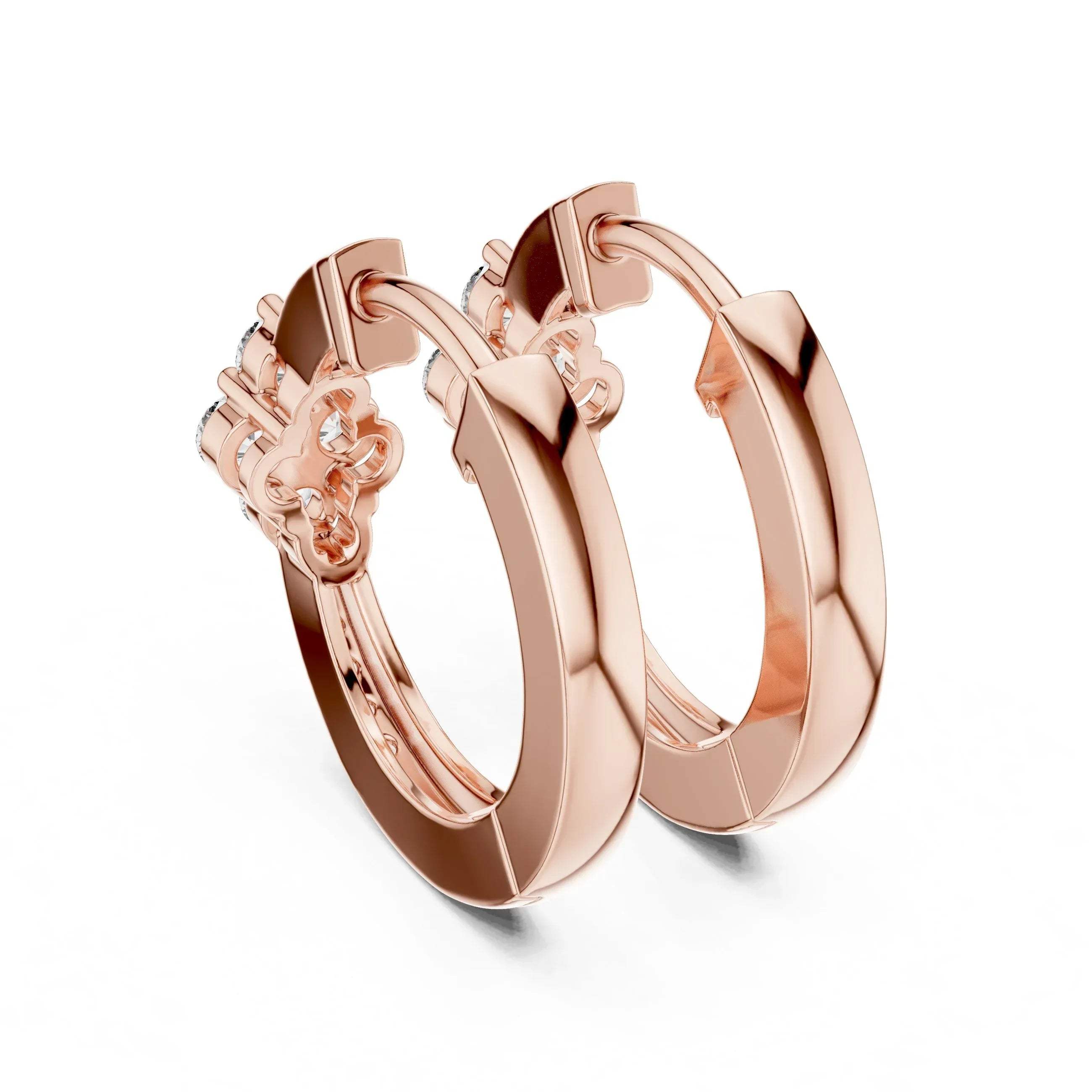 Rose gold hoop earrings with lab grown diamonds on a white background