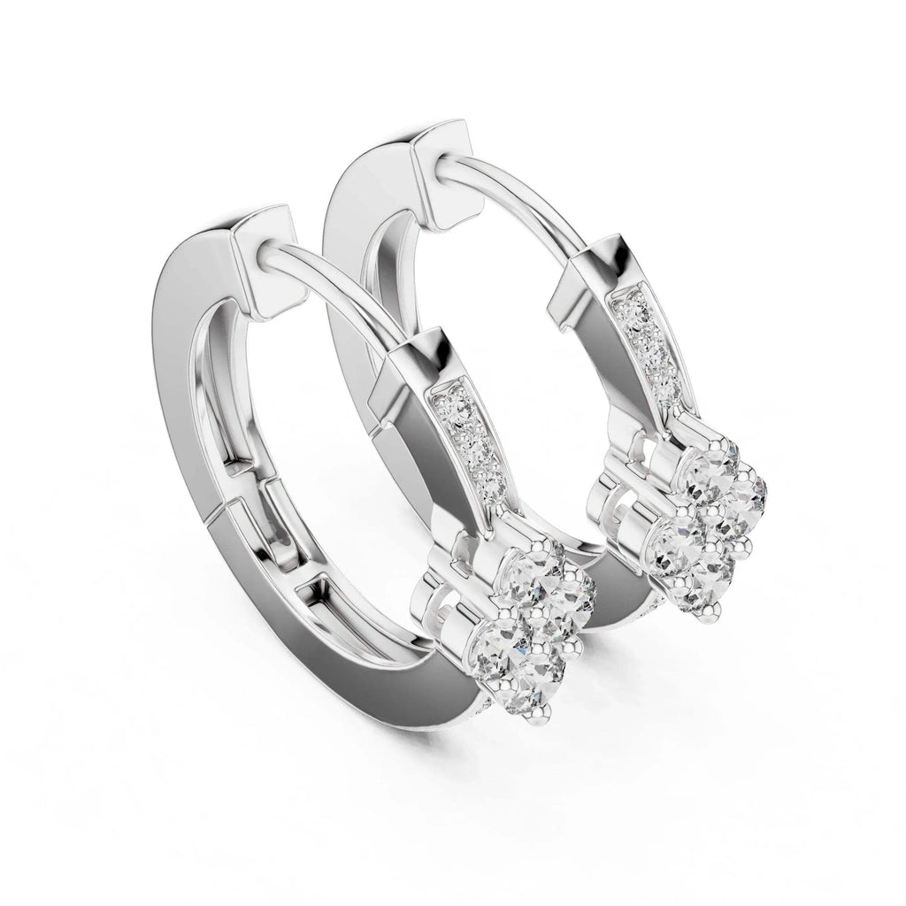 Pair of white gold hoop earrings with lab grown diamond accents on a white background