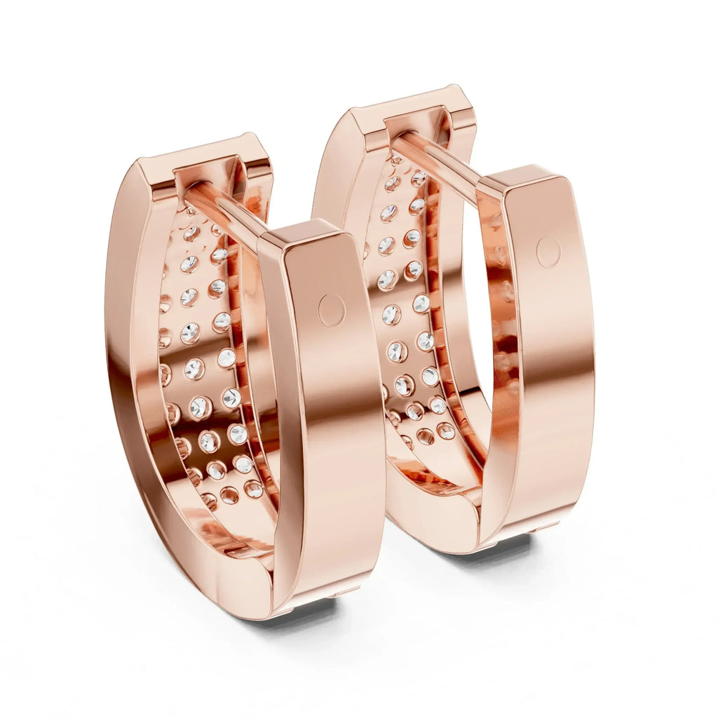Rose gold hoop earrings with embedded lab grown diamonds on a white background