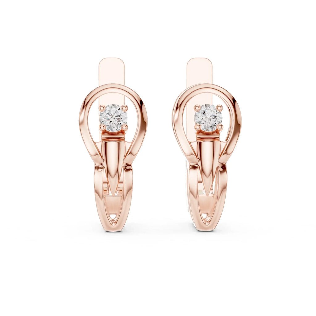 Rose gold earrings with lab grown diamond accents on a white background