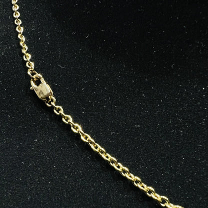 Gold chain on a black background
