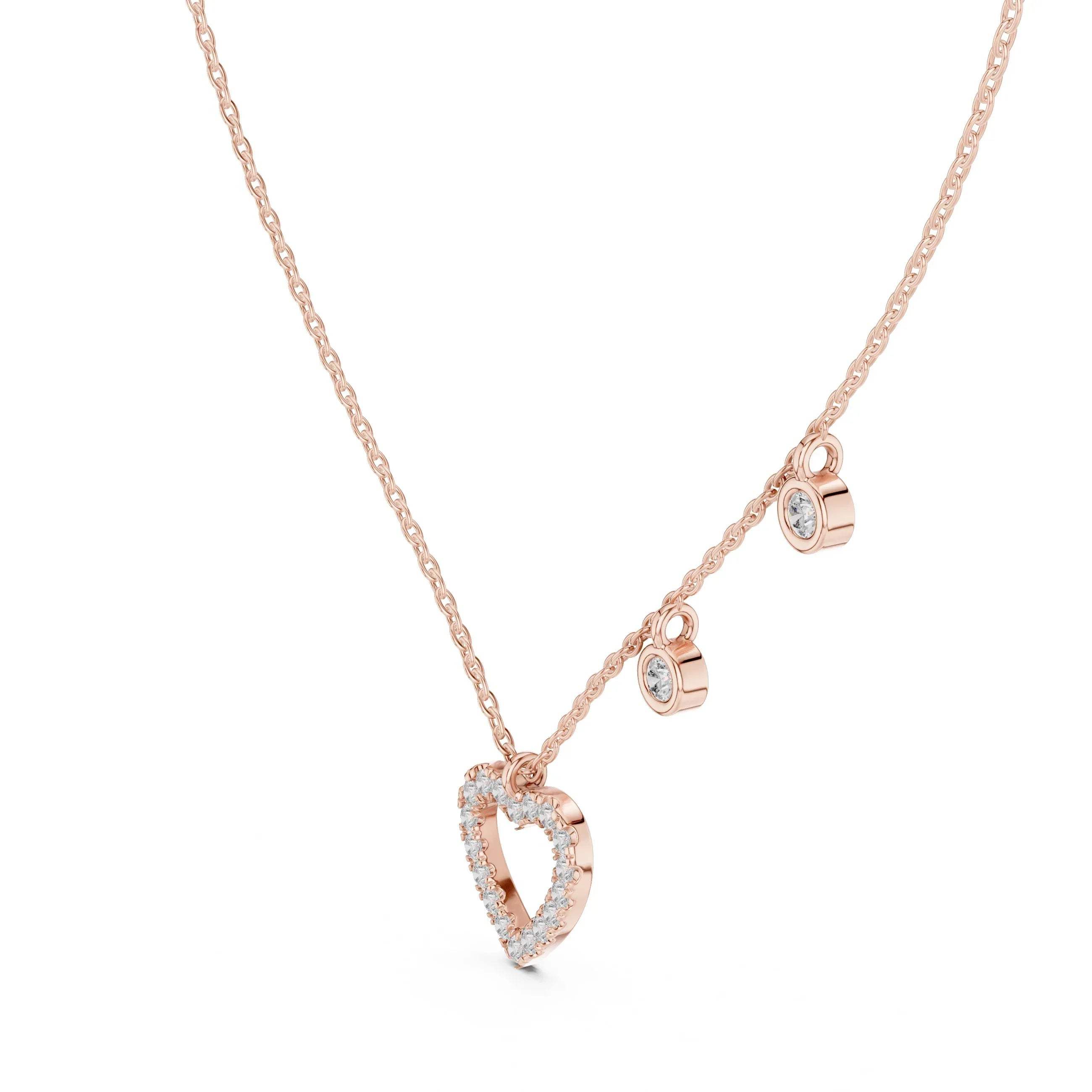 Rose gold necklace with heart-shaped pendant on a white background