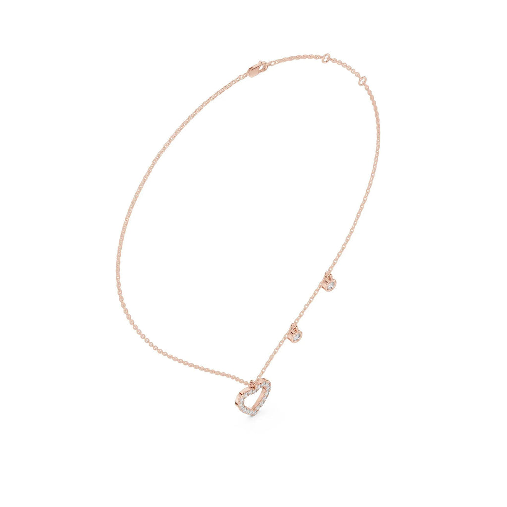 Rose gold necklace with a heart-shaped pendant on a white background