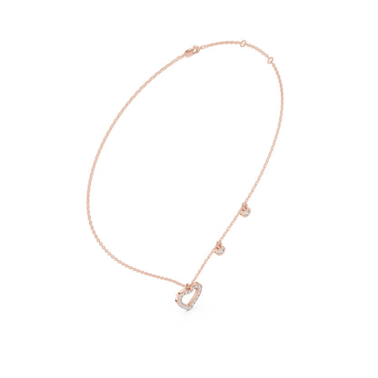 Rose gold necklace with a heart-shaped pendant on a white background