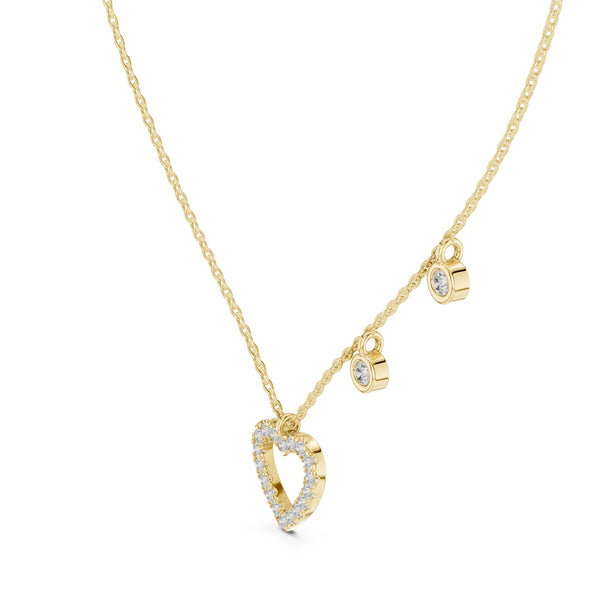 Gold necklace with a heart-shaped pendant on a white background